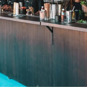 Green Jar Triple Rustic Bar - 4.25m mobile bar in dark brown rust-effect finish for outdoor weddings and events in Ibiza